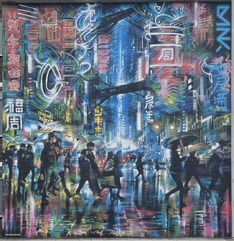 A mural made with spray paint on brick. It shows a crowd of people on a rainy street surrounded by bright neon signs like you&rsquo;d see in China or Japan. The signs reflect in the water on the ground and on the people&rsquo;s umbrellas