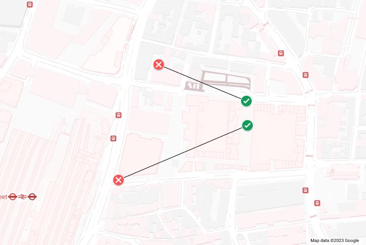 A map showing two pairs of map markers around Spitalfields Market, two are green ticks and two are green crosses. Each pair of tick and cross are joined by a line.